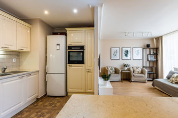 Obývací pokoj s kuchyňským koutem - Prodej bytu 3+kk v osobním vlastnictví 68 m², Praha 10 - Vršovice