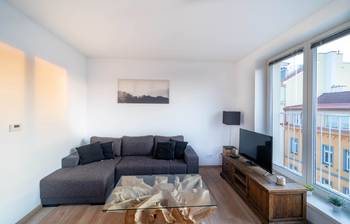 Obývací pokoj - jiný pohled - Prodej bytu 3+kk v osobním vlastnictví 77 m², Praha 8 - Libeň