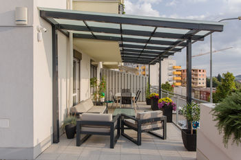 Zastřešená část terasy - Prodej bytu 4+kk v osobním vlastnictví 103 m², Brno