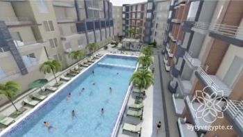 Vizualizace budoucího stavu vnitrobloku s bazénem - Prodej bytu 1+kk v osobním vlastnictví 38 m², Hurgáda