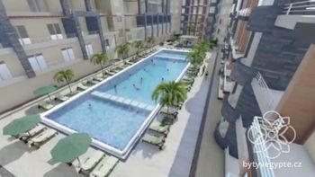 Vizualizace budoucího stavu vnitrobloku s bazénem - Prodej bytu 1+kk v osobním vlastnictví 38 m², Hurgáda