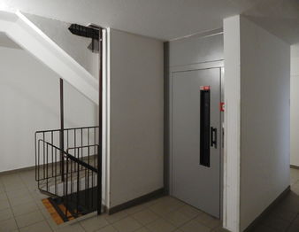 Schodiště a výtah - Prodej bytu 3+1 v osobním vlastnictví 64 m², Rakovník