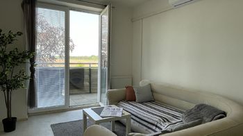 Obývací pokoj - Prodej bytu 2+kk v osobním vlastnictví 59 m², Pohořelice