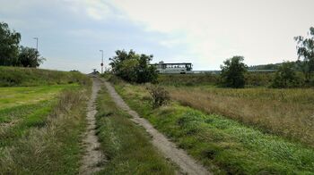 Polní příjezdová cesta. - Prodej pozemku 14090 m², Kolaje