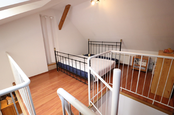 místnost v horním patře - Prodej bytu 3+kk v osobním vlastnictví 114 m², Praha 4 - Nusle