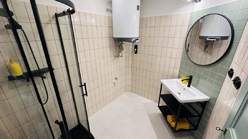 Koupelna - Pronájem bytu 1+kk v osobním vlastnictví 42 m², Praha 7 - Holešovice
