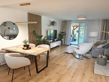 Kuchyňský kout, jídelní kout a obývací pokoj se vstupem na terasu a zahradu.  - Prodej domu 128 m², Nová Ves