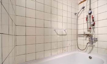 koupelna - Prodej bytu 1+1 v osobním vlastnictví 32 m², Kladno