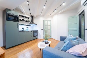 Obývací prostor s kuchyní - Prodej bytu 1+kk v osobním vlastnictví 40 m², Praha 7 - Holešovice