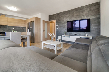 Obývací pokoj - Prodej bytu 3+kk v osobním vlastnictví 81 m², Praha 9 - Letňany 