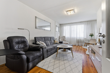 Obývací pokoj - Prodej bytu 3+kk v osobním vlastnictví 74 m², Praha 9 - Prosek 