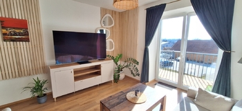 Obývací pokoj s kuchyňským koutem - Prodej bytu 2+kk v osobním vlastnictví 49 m², Rostěnice-Zvonovice