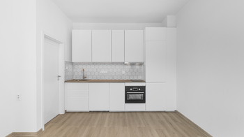 Kuchyňská linka má dostatek úložných prostor - Pronájem bytu 1+kk v družstevním vlastnictví 27 m², Praha 9 - Libeň 