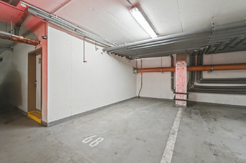 Garažové stání - Prodej bytu 2+kk v osobním vlastnictví 55 m², Praha 9 - Letňany