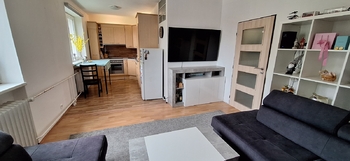 Obývací pokoj s kuchyňským koutem - Prodej bytu 2+kk v osobním vlastnictví 54 m², Jedovnice