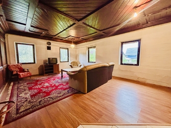 Obývací pokoj v přízemí - Prodej domu 260 m², Brniště