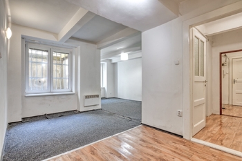 Místnost s kuchyňským koutem - Prodej bytu 2+kk v osobním vlastnictví 57 m², Praha 3 - Žižkov