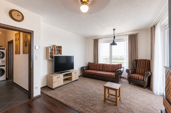 Obývací pokoj - Prodej bytu 2+kk v osobním vlastnictví 70 m², Praha 9 - Letňany
