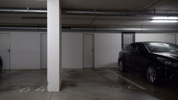 Parkovací stání v garáži - Pronájem bytu 3+kk v osobním vlastnictví 76 m², Rajhrad